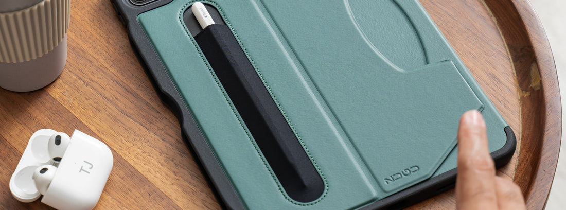 A man uses his Apple pencil as a drawing tool while working on his iPad