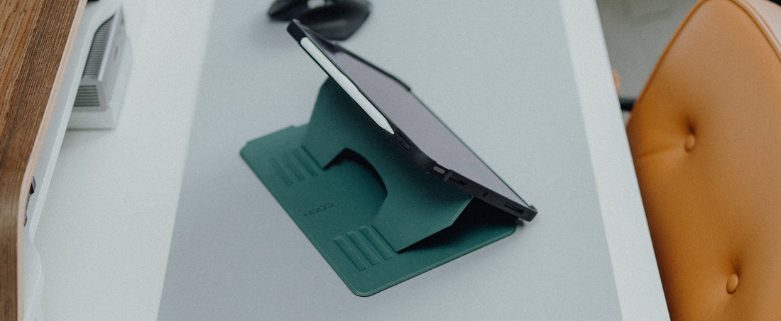 An iPad housed in a Pine ZUGU case sitting on a desk.