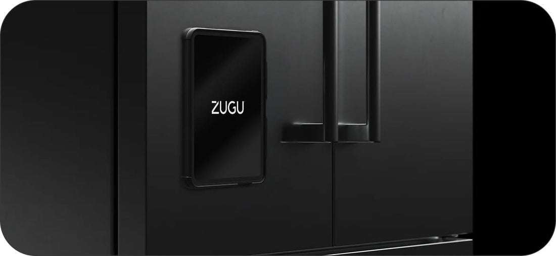 iPad in a ZUGU 360 case magnetically mounted on a black fridge, screen displaying the ZUGU logo 