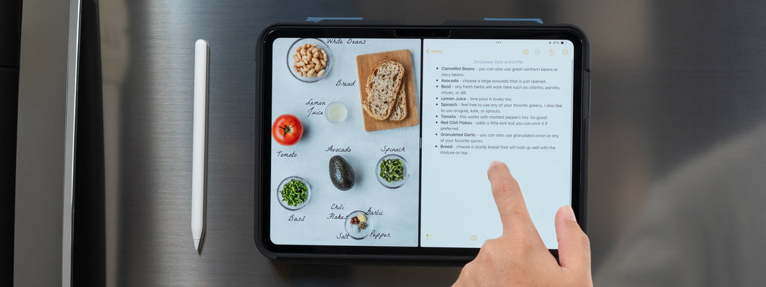 iPad mounted on a fridge in a ZUGU case, split-screen showing a recipe photo alongside handwritten ingredient notes in the Notes app 