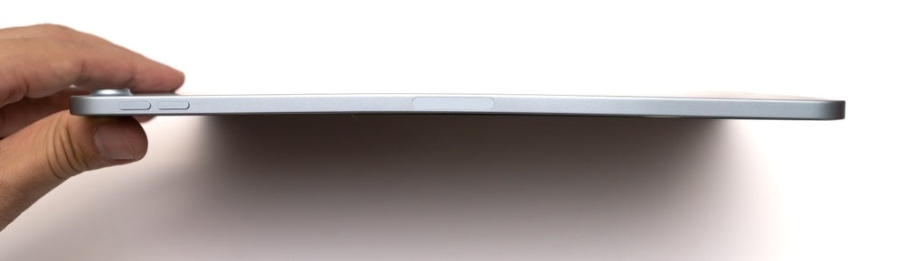 person holding white stylus pen over iPad
